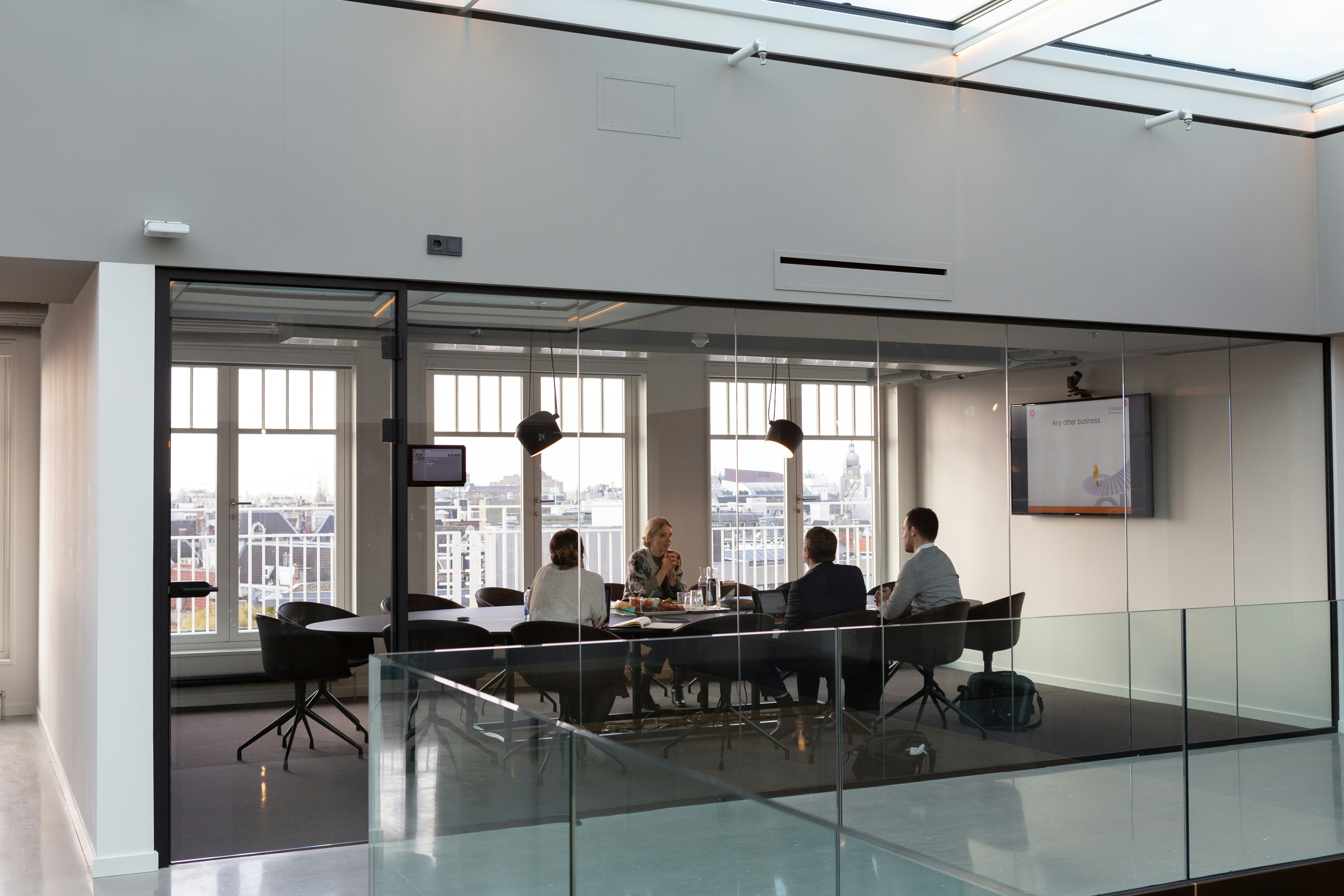 People sitting together inside a modern workplace
